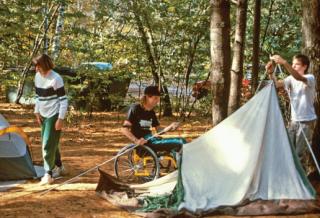 Family setting up tent