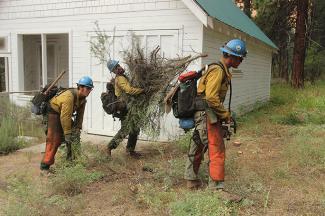 Firefighters clearing brush around building-685x455px-flag.jpg Firefighters clearing brush around building-685x455px-flag