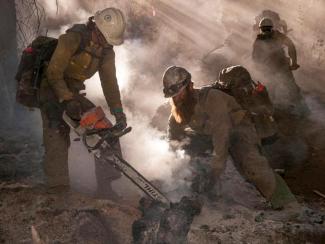 Hotshot firefighters using chainsaws and mopping up.jpg Hotshot firefighters using chainsaws and mopping up