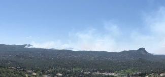 Smoke from prescribed fire rising near Thumb Butte.