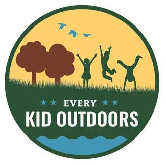 A colorful graphic design image logo with kids playing outdoors with grass, trees and birds