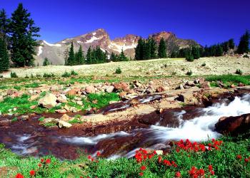 Mountains in the background with a river in front