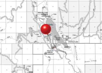 Graphic of a motor vehicle use map with a red map pin in the center.