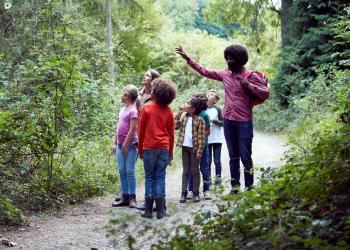 teacher with children outdoors