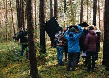 Film crew in forest