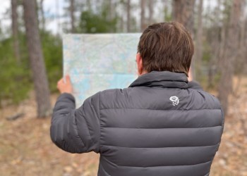 A person holding a map.