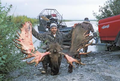 Hunter with moose taken in a subsistence moose hunt.