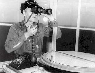 photo of towerman with binoculars
