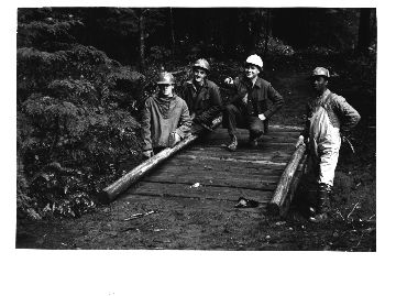 Section of trail & trail bridge along Clackamus River built by Timber Lake Job Corpsmen. Timber Lake JCCC - (L. to R.) Hubert Vitatoe, Clintwood, Va. Bill Clowers, Powell, Tenn. Vern Fridley, Work Supervisor. John Green, Savannah, Ga.