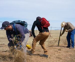 volunteers work on fencing on the Kiowa National Grassland