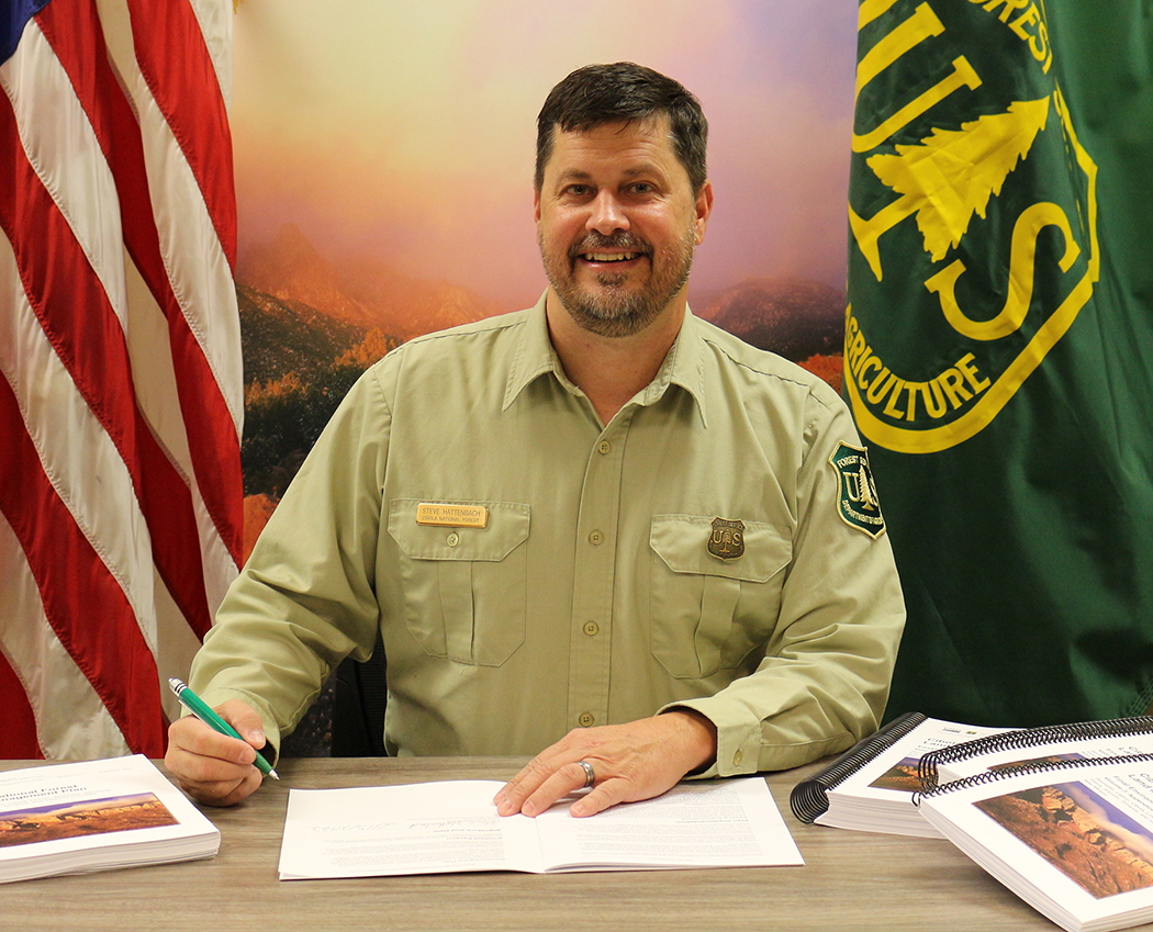 Forest Supervisor Steve Hattenbach signs Record of Decision
for the new Cibola National Forest Land Management Plan