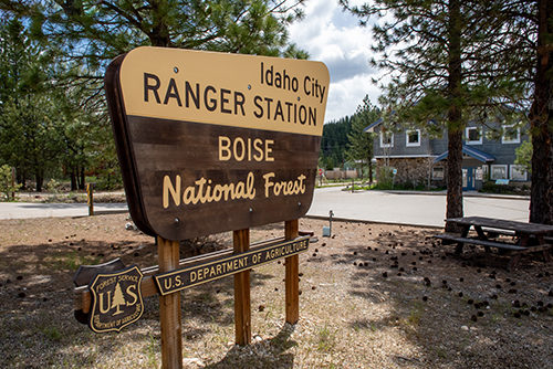 Ranger district sign with building
