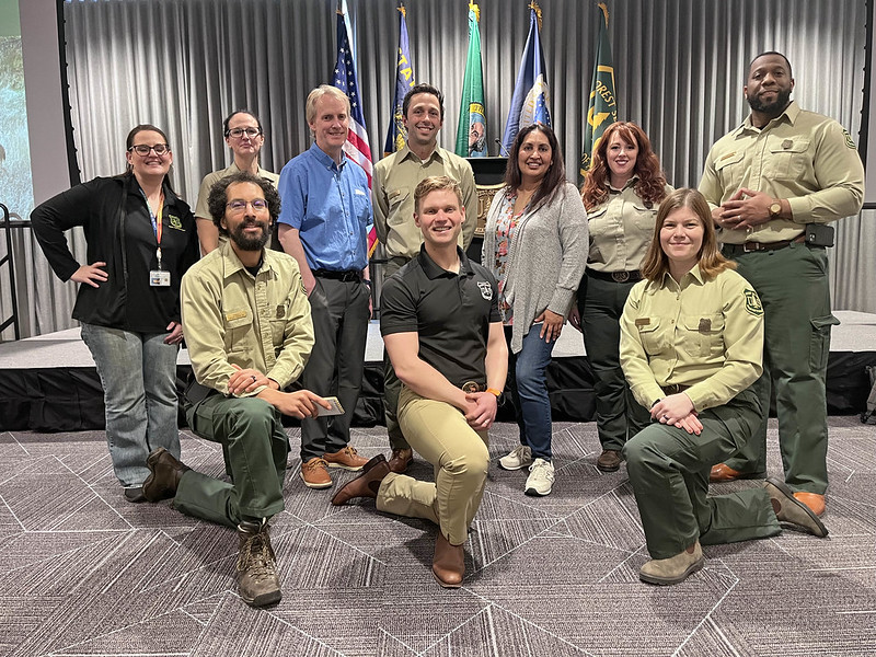 A group of Forest Service employees pose for a photo.