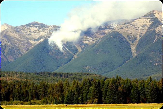 View of the Blackfoot Swan Project Area with mountains and low clouds