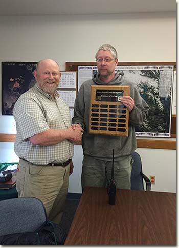Chris Budke receives 2015 Forest Management Employee of the Year from District Ranger Art Burbank