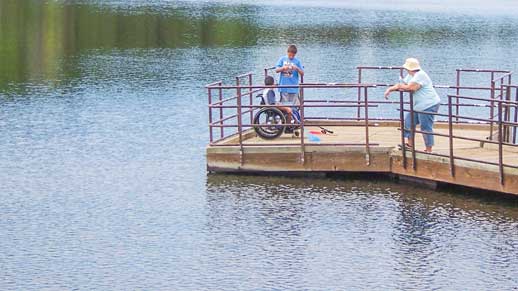 People fishing off a pier at Lynx Lake
