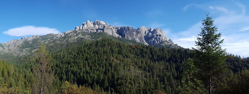 The rugged granite peaks of the Castle Crags Wilderness rise above the forested valley below