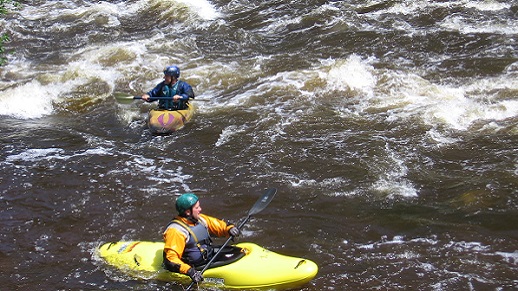  Two kayakers on the Upper Poudre River.