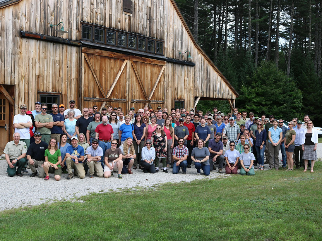 Employees of the White Mountain National Forest gather at the history Russell Corbath barn.