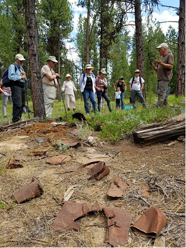 Don Hann speaking to a group of volunteers at a site on the Malheur National Forest