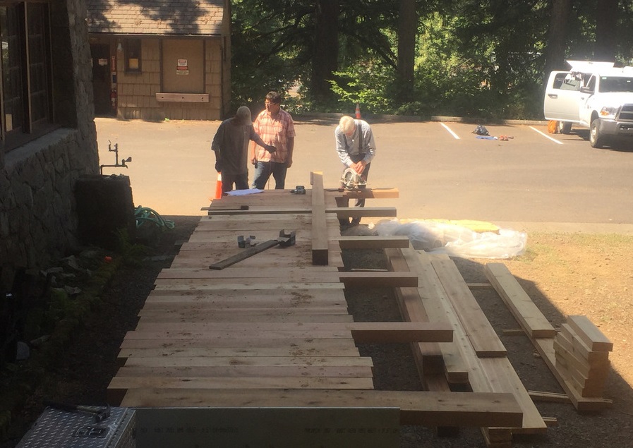 Building a wooden bridge on site before moving it.