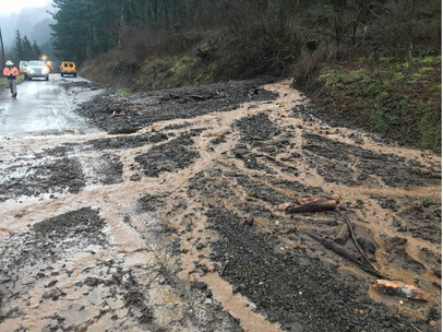 A mudslide covers the historic highway in the Gorge,