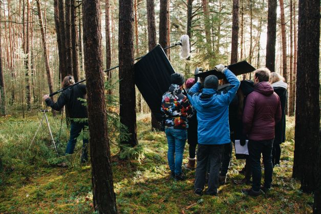 Film crew recording in the forest.