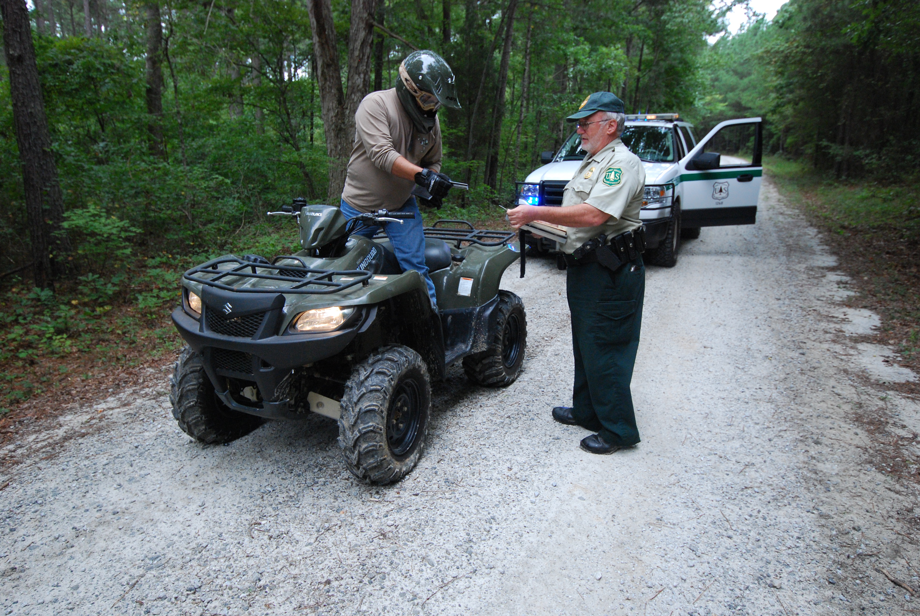Forest Officer checking ATV