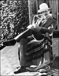 Amos Pinchot relaxing in rocking chair