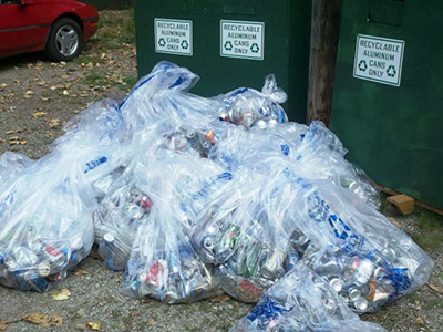 Pile of aluminum cans collected near the river to be recycled.