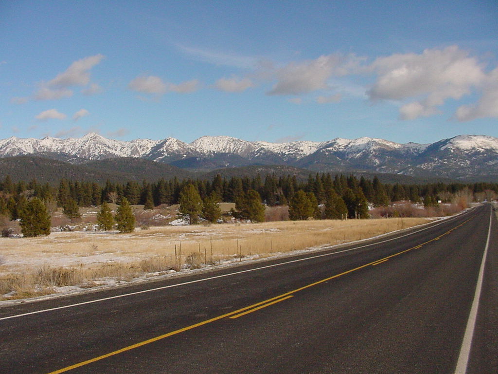 Juorney Through Time Scenic Byway with snow capped Elkhorns peaks in background