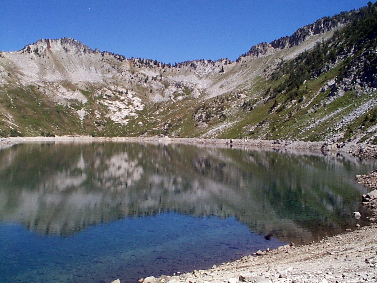 Shoreside view of Eagle Lake with rocky bare subalpine hills in background