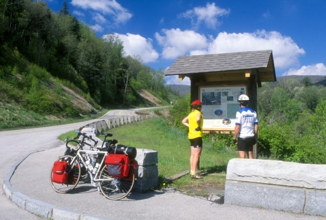 Bicyclists stopping to look at a sign along the Cherohala Skyway