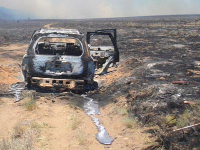 Burned vehicle in fire zone