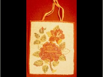 Image of a bag with beaded flower design