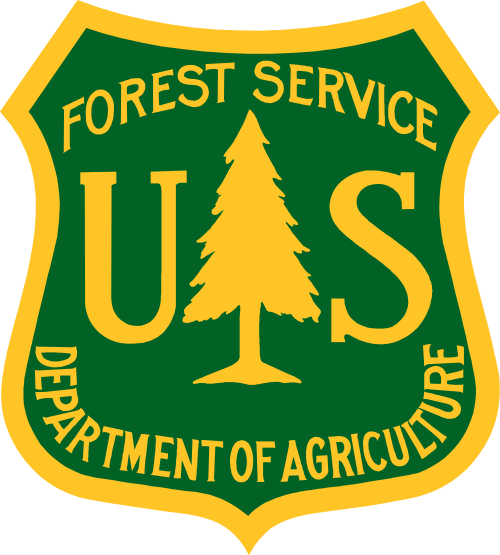 The Forest Service green and yellow insignia