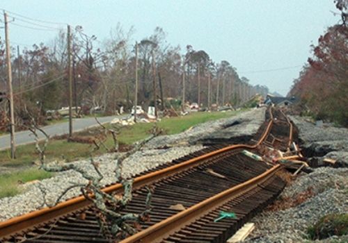 uprooted and twisted train track damage from Hurricane Katrina.