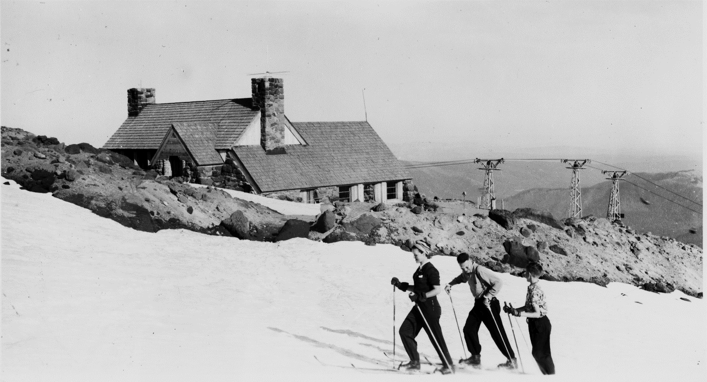 Slicox Hut with skiers in the foreground