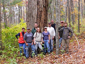 Students from Southeastern Technical College explore woodland habitat on their hike to Keener Bog