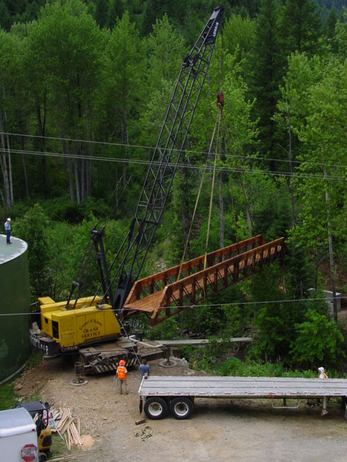 Photo of crane lowering bridge into place