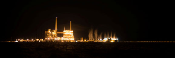 A night-time photo of an industrial facility
