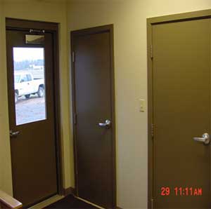 Photo of two interior doors and one exterior door.