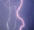 [photographic] A picture of a flash of lightning through a dark sky