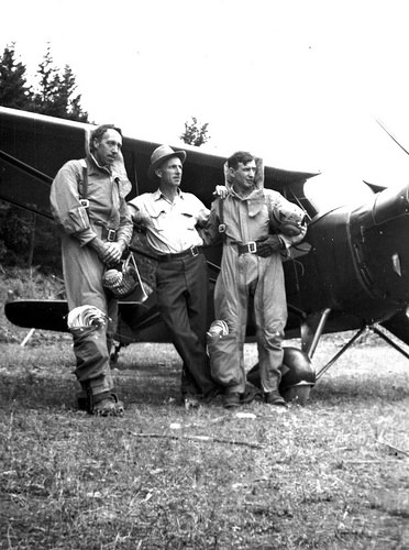 A photo of Rufus Robinson, Frank Derry and Earle Cooley standing next to an airplane.