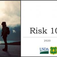Risk Management with person in front of lake with mountains looking up.