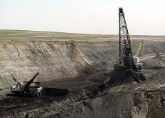 Large mining equipment operating in a surface coal mine.