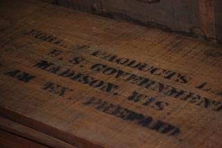 A picture showing a wood top with lettering painted on top - Forest Products Laboratory, U.S. Government, Madison WIS.