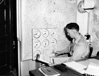 Black and White picture of a zone fire dispatcher at Shasta National Forest