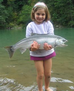 Image of a child holding a Salmon.