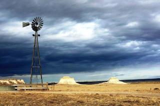 A windmill and water basin on the Pawnee National Grassland near Pawnee Buttes